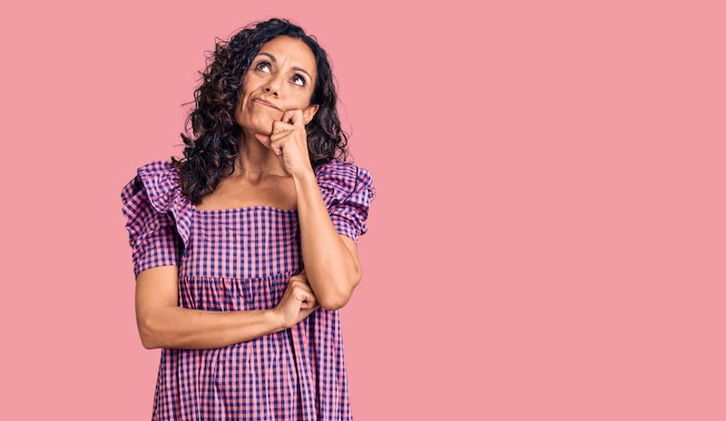 Woman thinking about switching her breast implants